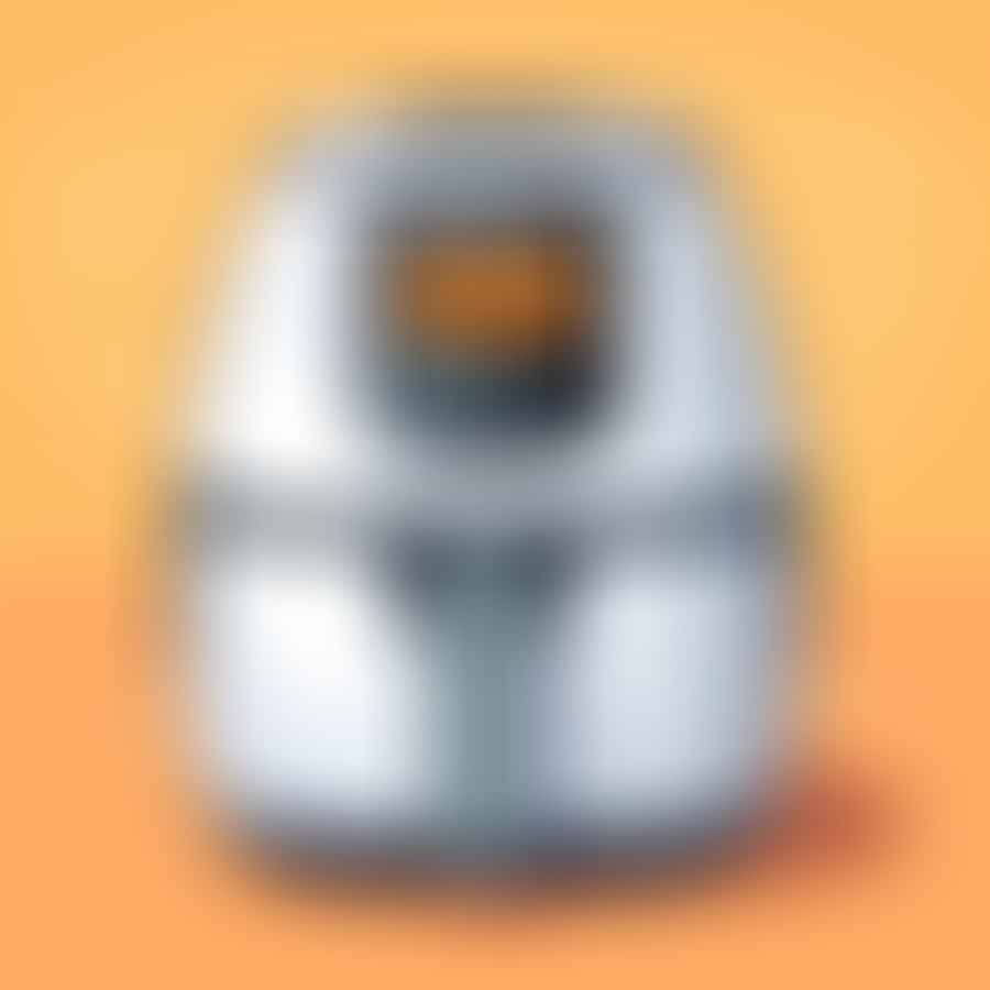 Air fryer with digital display showing preheating temperature